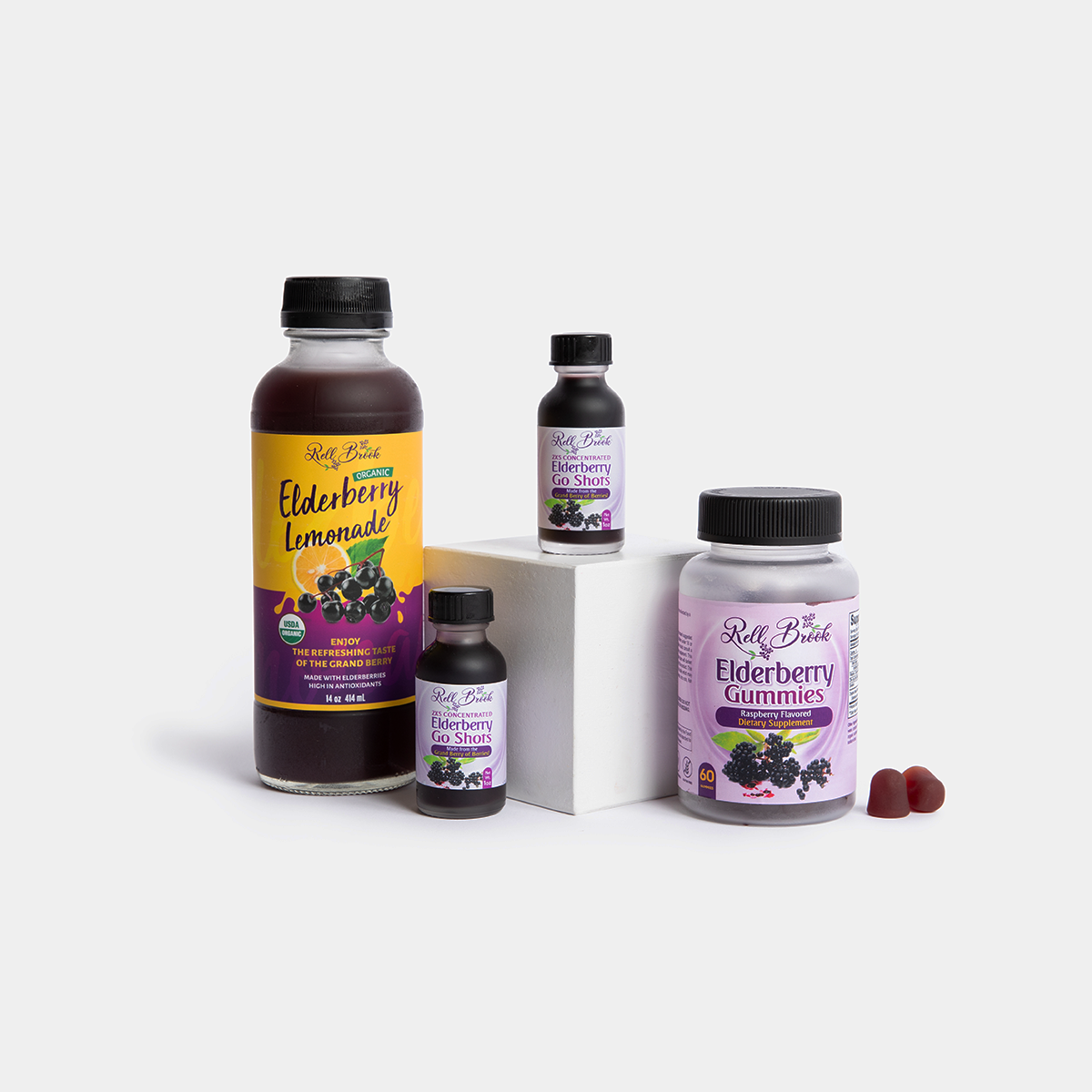 Elderberry Lemonade, a bottle of Elderberry Gummies, and 2 Elderberry Go Shots